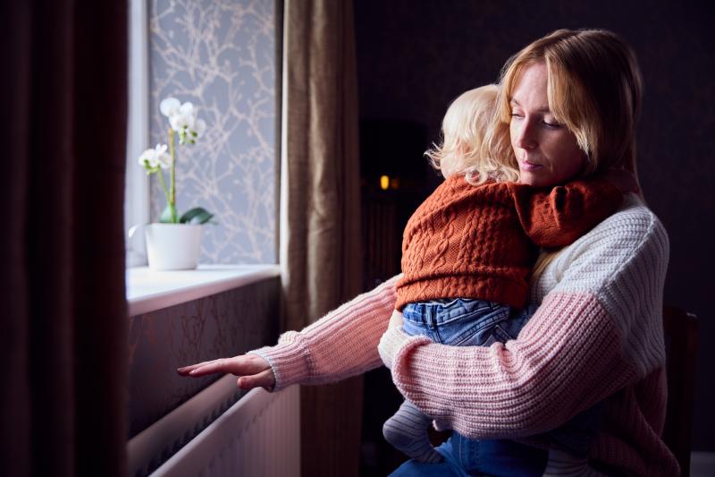Woman and child by radiator